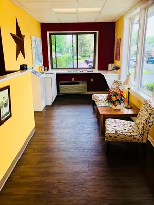a waiting room with a couch and a table and chairs at Hampton Inn (not a Hilton Affiliate) Camp Hill - Harrisburg SW in Harrisburg