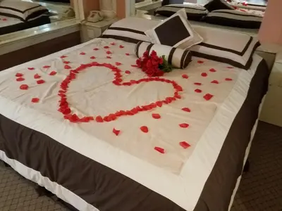 a bed with a heart made out of roses at Gallery Holiday Motel in South Amboy