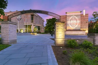 a university building with an arch in front of it at Holiday Inn Scranton East - Dunmore by IHG in Dunmore