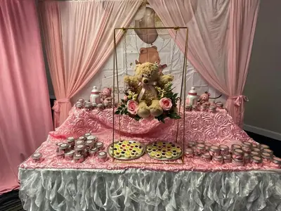 a table with a bunch of cupcakes and a teddy bear at Holiday Inn Scranton East - Dunmore by IHG in Dunmore