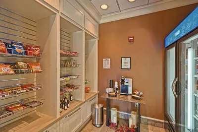 a food pantry in a restaurant with food on display at Hilton Garden Inn by Hilton Mount Laurel in Mount Laurel