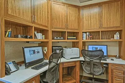 an office with a desk with a computer and two chairs at Hilton Garden Inn by Hilton Mount Laurel in Mount Laurel
