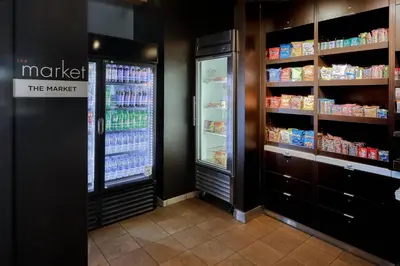 a grocery store aisle with a refrigerator and drinks at Courtyard by Marriott York in York