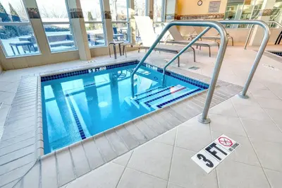 a swimming pool in a building with a no swimming sign at Courtyard by Marriott York in York