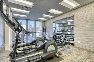 a gym with treadmills and elliptical machines at Courtyard by Marriott York in York