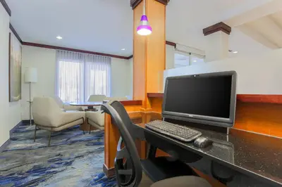 an office with a computer on a desk with a keyboard at Fairfield Inn & Suites by Marriott Mahwah in Mahwah