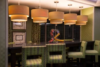 a dining room with a table and some chairs at Holiday Inn Express and Suites Dickson City by IHG in Dickson City