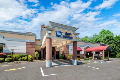 a building with a walmart sign in a parking lot at Best Western Inn at Ramsey in Ramsey