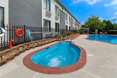 a pool in the courtyard of a apartment building at Spark By Hilton Hummelstown Hershey in Hummelstown