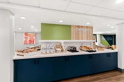 a dental office with a blue and white counter at Spark By Hilton Hummelstown Hershey in Hummelstown