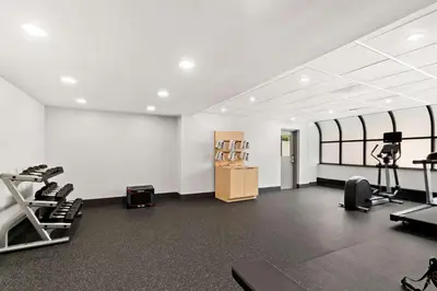a gym with treadmills and ellipticals in a room at Spark By Hilton Hummelstown Hershey in Hummelstown
