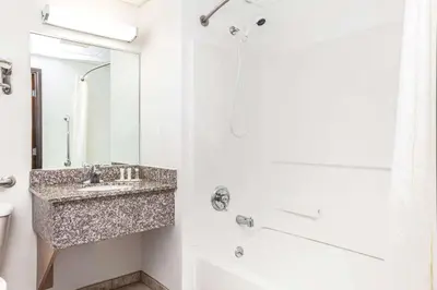 a bathroom with a sink and a shower at Super 8 by Wyndham Mahwah in Mahwah