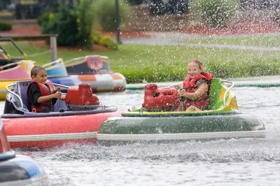 two people riding on a raft in the water at Pocono Mountain Villas MOD Collection by Sonesta in East Stroudsburg