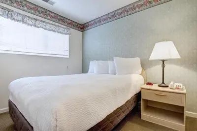 a bedroom with a large bed and a window at Pocono Mountain Villas MOD Collection by Sonesta in East Stroudsburg