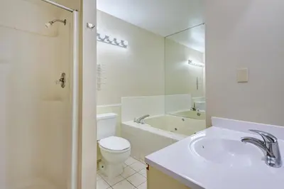 a bathroom with a sink and a toilet and a tub at Pocono Mountain Villas MOD Collection by Sonesta in East Stroudsburg