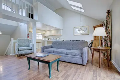 a living room with a couch and a table at Pocono Mountain Villas MOD Collection by Sonesta in East Stroudsburg