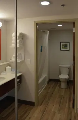 a bathroom with a toilet and a shower and a sink at Hampton Inn & Suites Philadelphia/Media in Media