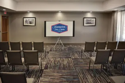 a conference room with chairs and a projection screen at Hampton Inn & Suites Philadelphia/Media in Media