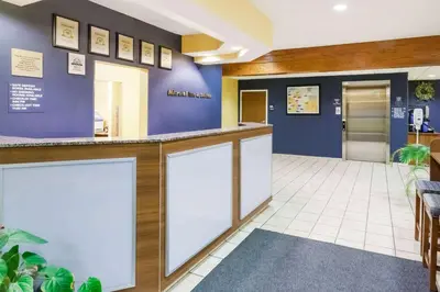 a lobby of a hospital with a reception counter at Microtel Inn & Suites in Dickson City