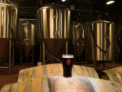 a glass of beer sitting on top of a barrel at Shawnee Inn and Golf Resort in East Stroudsburg