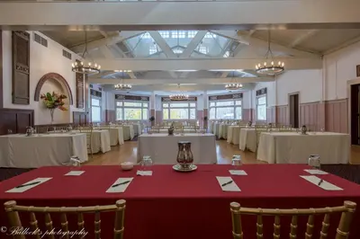 a banquet hall with white tables and chairs at Shawnee Inn and Golf Resort in East Stroudsburg