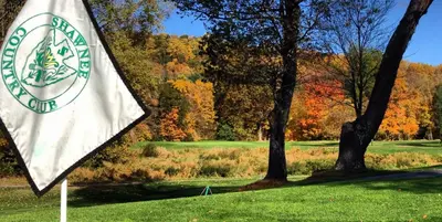a flag in the grass next to a golf course at Shawnee Inn and Golf Resort in East Stroudsburg