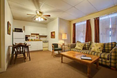 a living room with a couch and a table at Suites on Main in Margaretville