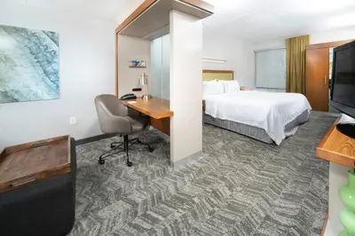 a hotel room with a bed and a desk and a computer at SpringHill Suites by Marriott Philadelphia Valley Forge/King of Prussia in King of Prussia