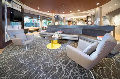 a living room with two chairs and a couch at SpringHill Suites by Marriott Philadelphia Valley Forge/King of Prussia in King of Prussia