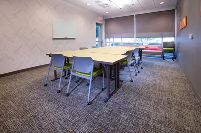 a conference room with a long table and chairs at SpringHill Suites by Marriott Philadelphia Valley Forge/King of Prussia in King of Prussia