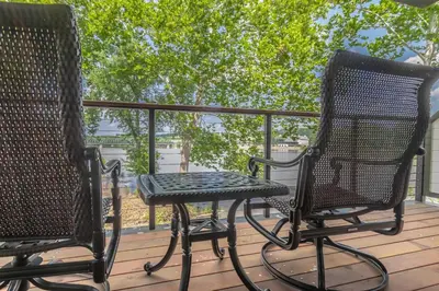 two chairs and a table on a deck at Carriage House New Hope in New Hope