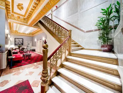 a staircase in a home with a gold ceiling at Radio City Apartments in New York