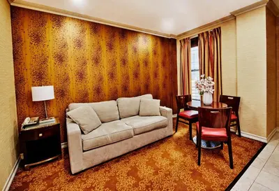 a living room with a couch and a table at Radio City Apartments in New York