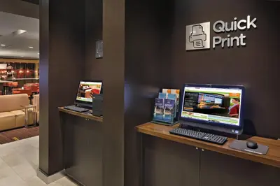 a counter with a computer on it in a store at Courtyard Philadelphia Coatesville Exton in Coatesville