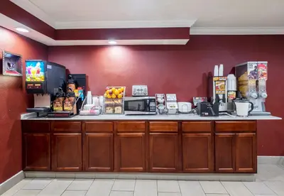 a counter in a hotel room with a coffee shop at Red Roof Inn Binghamton North in Binghamton