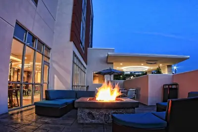 a fire pit in the middle of a patio at SpringHill Suites by Marriott Scranton Montage Mountain in Moosic