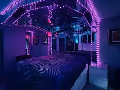 a bedroom with a bed covered in purple lights at Executive Inn Coopersburg in Coopersburg