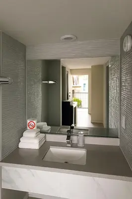 a bathroom with a sink and a mirror at Executive Inn Coopersburg in Coopersburg