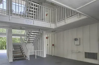 a hallway with a staircase in a building at Motel 6-New Cumberland, PA - Harrisburg - Hershey South in New Cumberland