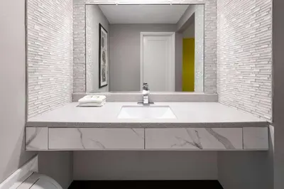 a bathroom with a sink and a mirror at Super 8 by Wyndham Hazleton in Hazleton