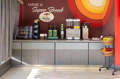 a coffee shop with a counter with fruit on it at Super 8 by Wyndham Hazleton in Hazleton