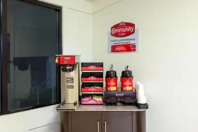 a counter with some food on it next to a window at Travelodge by Wyndham Essington / Philadelphia Airport in Essington