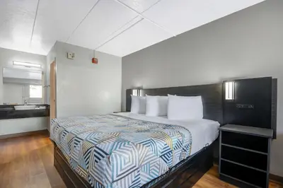 a bedroom with a large bed in a room at Motel 6-York, PA in York