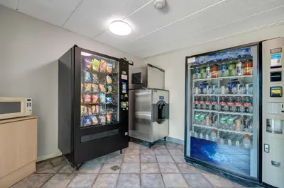 a large refrigerator with drinks in it in a store at Motel 6-York, PA in York