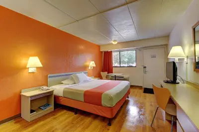 a hotel room with a bed and a desk at Motel 6-York, PA in York