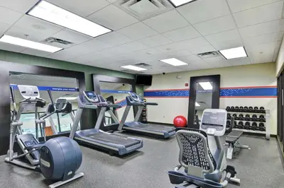 a gym with treadmills and elliptical machines at Hampton Inn Tunkhannock in Tunkhannock