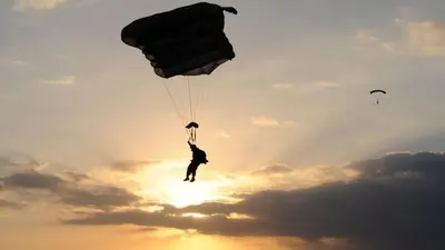 a person parachutes into the sky with a parachute at Holiday Inn Express and Suites Stroudsburg-Poconos by IHG in Stroudsburg