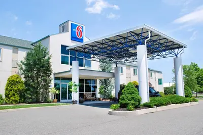 a building with a gas station at Motel 6-Pottstown, PA in Pottstown
