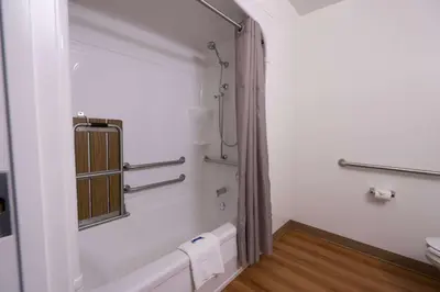 a bathroom with a bath tub and a sink at Motel 6-Pottstown, PA in Pottstown