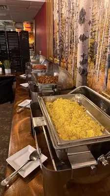 a buffet line with many trays of food at Split Rock Resort in Lake Harmony